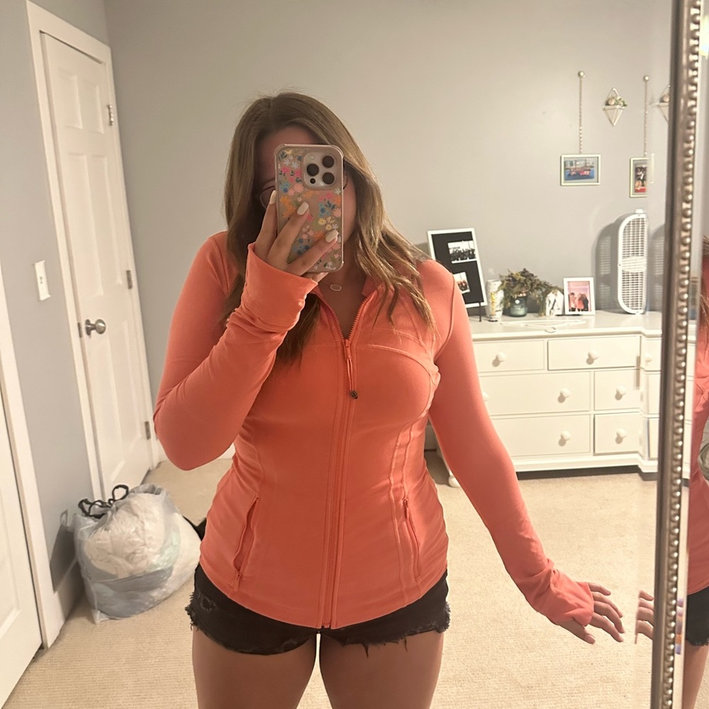 It’s is a lululemon align jacket in color sunny coral!